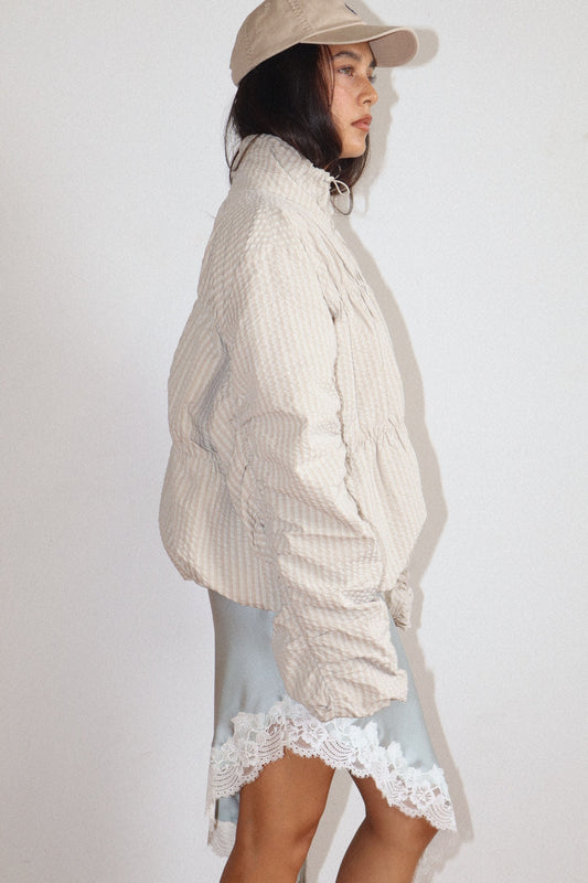 high neck beige textured zip-up jacket