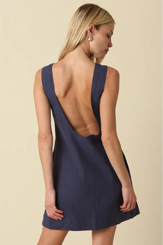 sleeveless, knee-length navy blue linen dress with open back