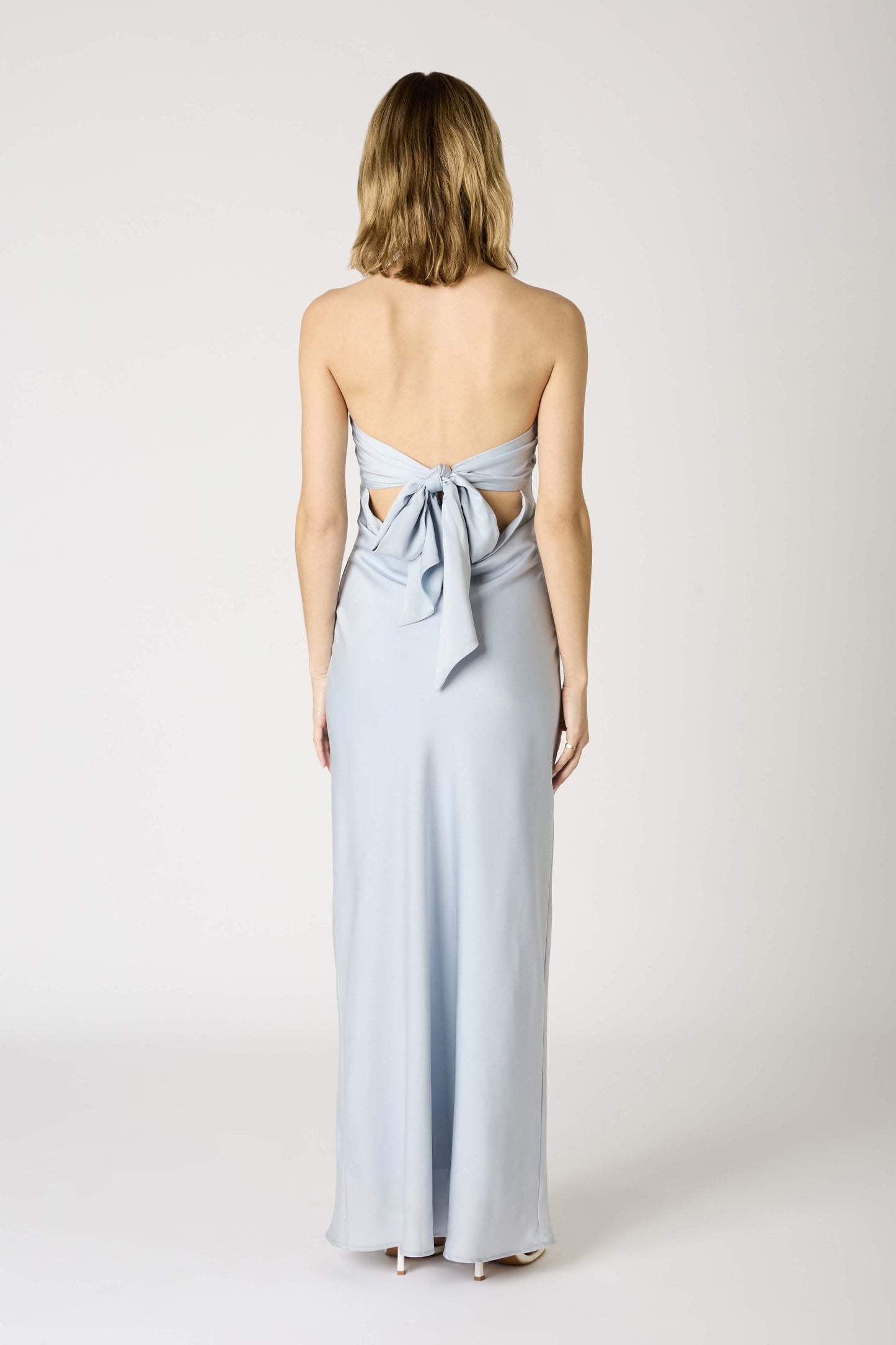  light blue strapless gown with a bow detail