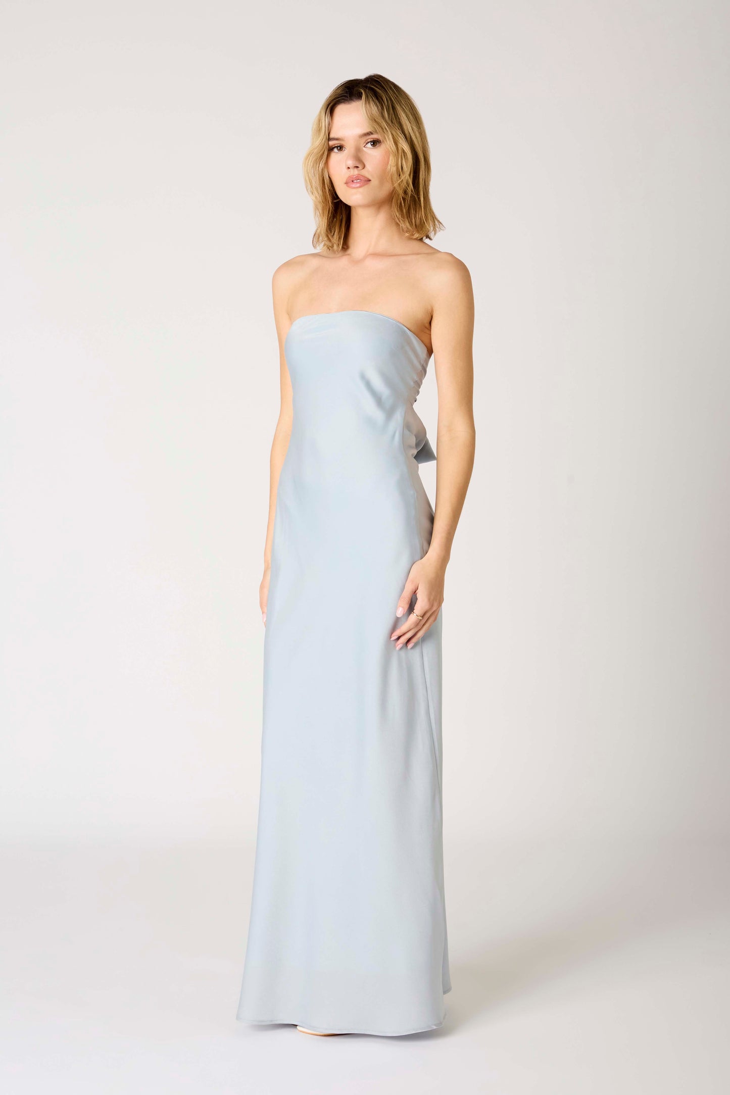  light blue strapless gown with a bow detail