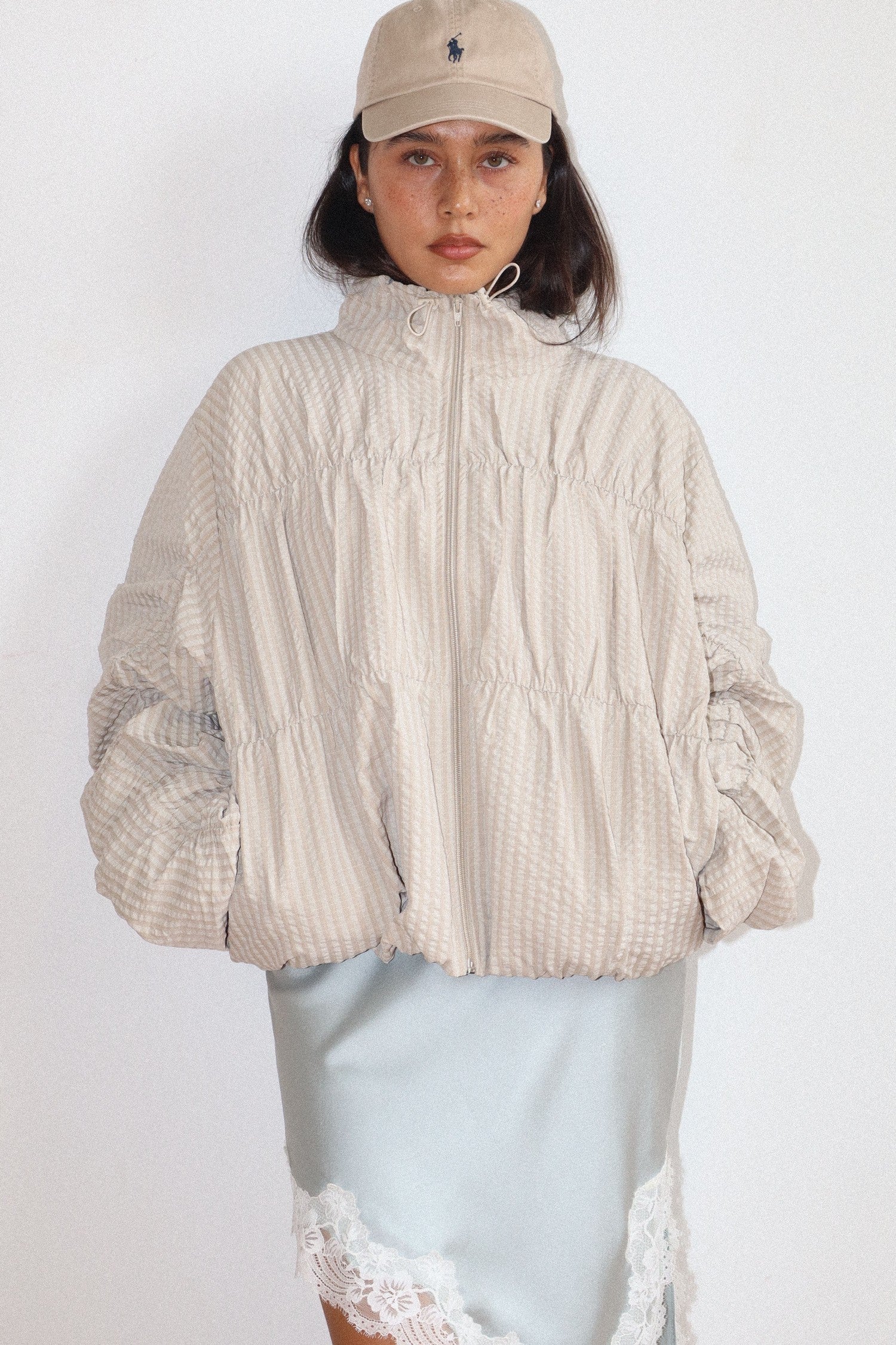high neck beige textured zip-up jacket 