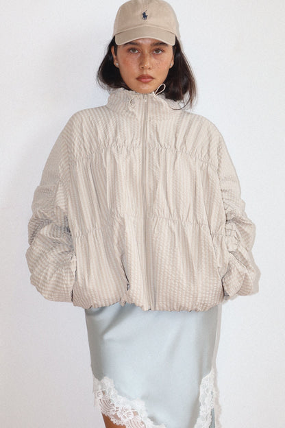 high neck beige textured zip-up jacket 