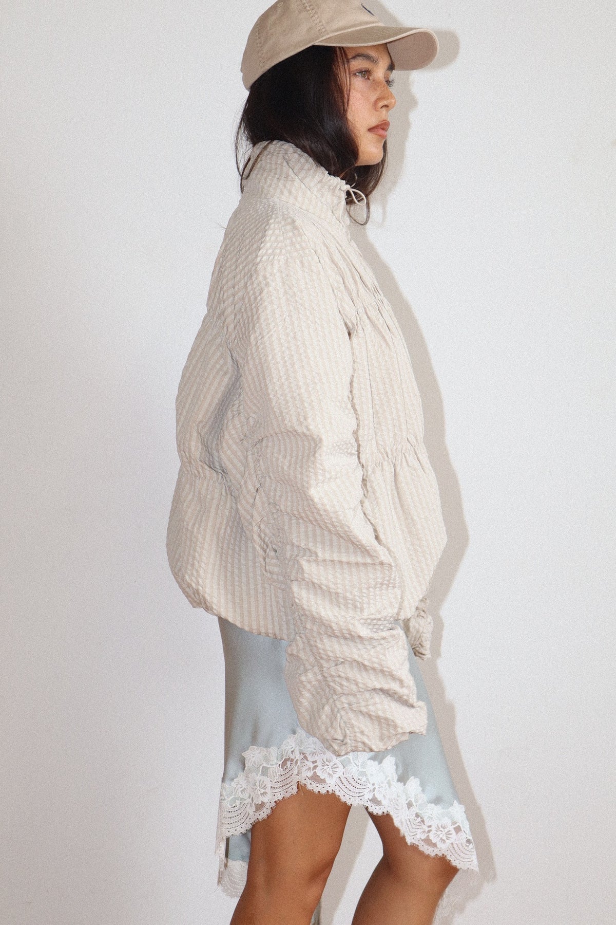 high neck beige textured zip-up jacket 
