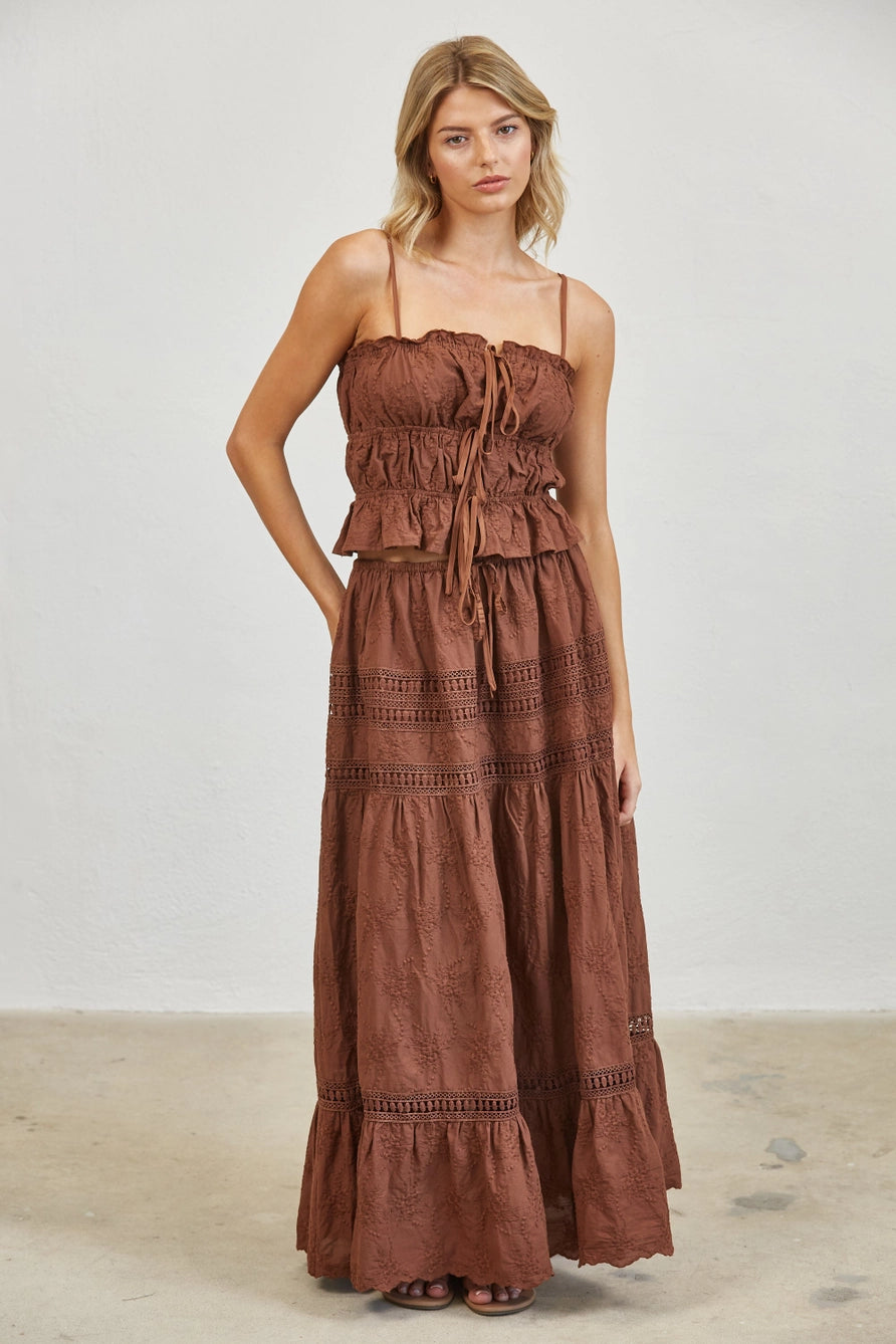 brown two-piece set consisting of a smocked crop tank with embroidery and embroidered maxi skirt 