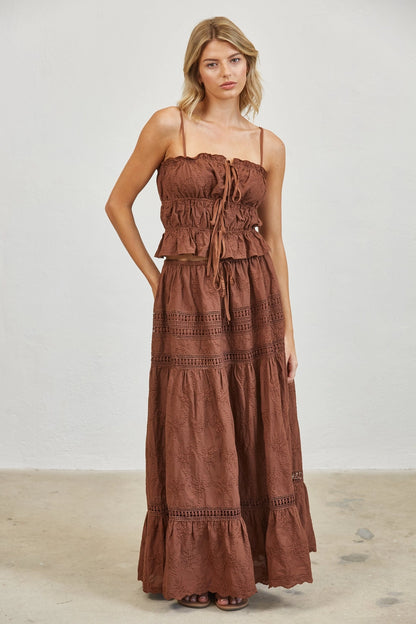 brown two-piece set consisting of a smocked crop tank with embroidery and embroidered maxi skirt 