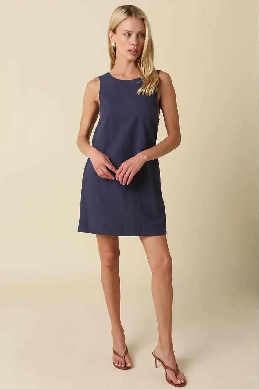 sleeveless, knee-length navy blue linen dress with open back