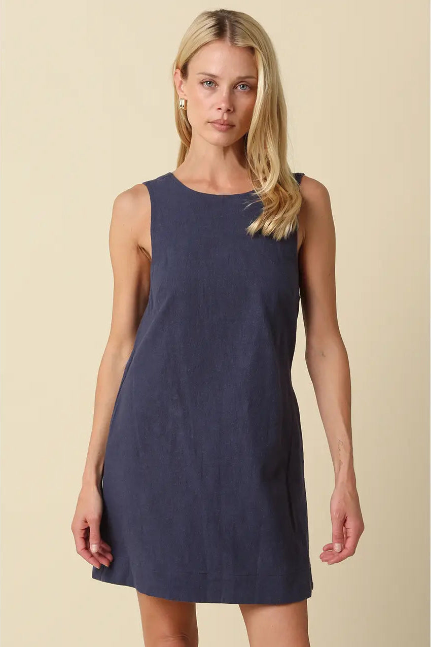 sleeveless, knee-length navy blue linen dress with open back
